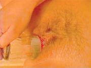 Malene inserting a bottle in her pussy